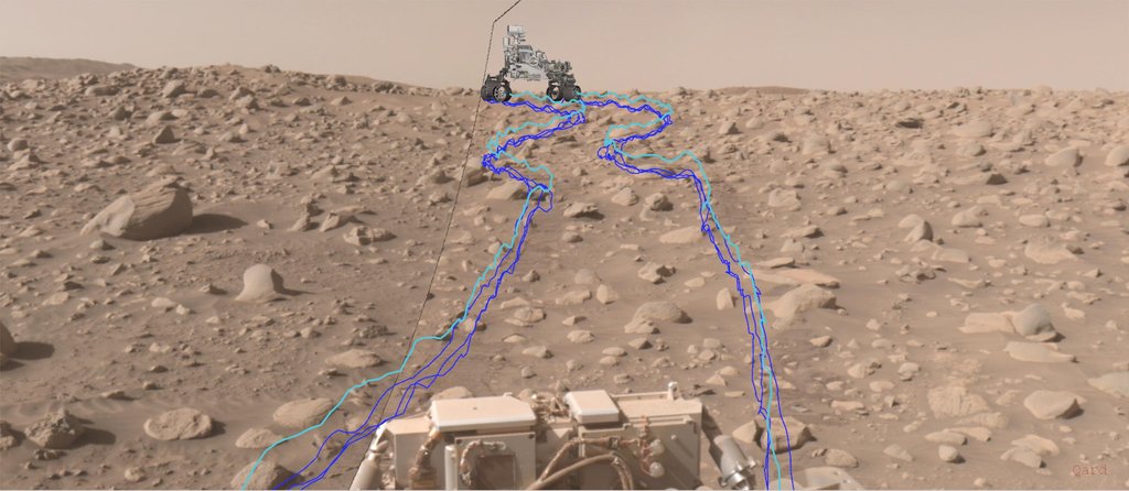A rock-strewn Martian slope photographed by Perseverance's navigation camera. JPL added a computer model of the rover and winding blue lines that trace the path its wheels took around the boulders.