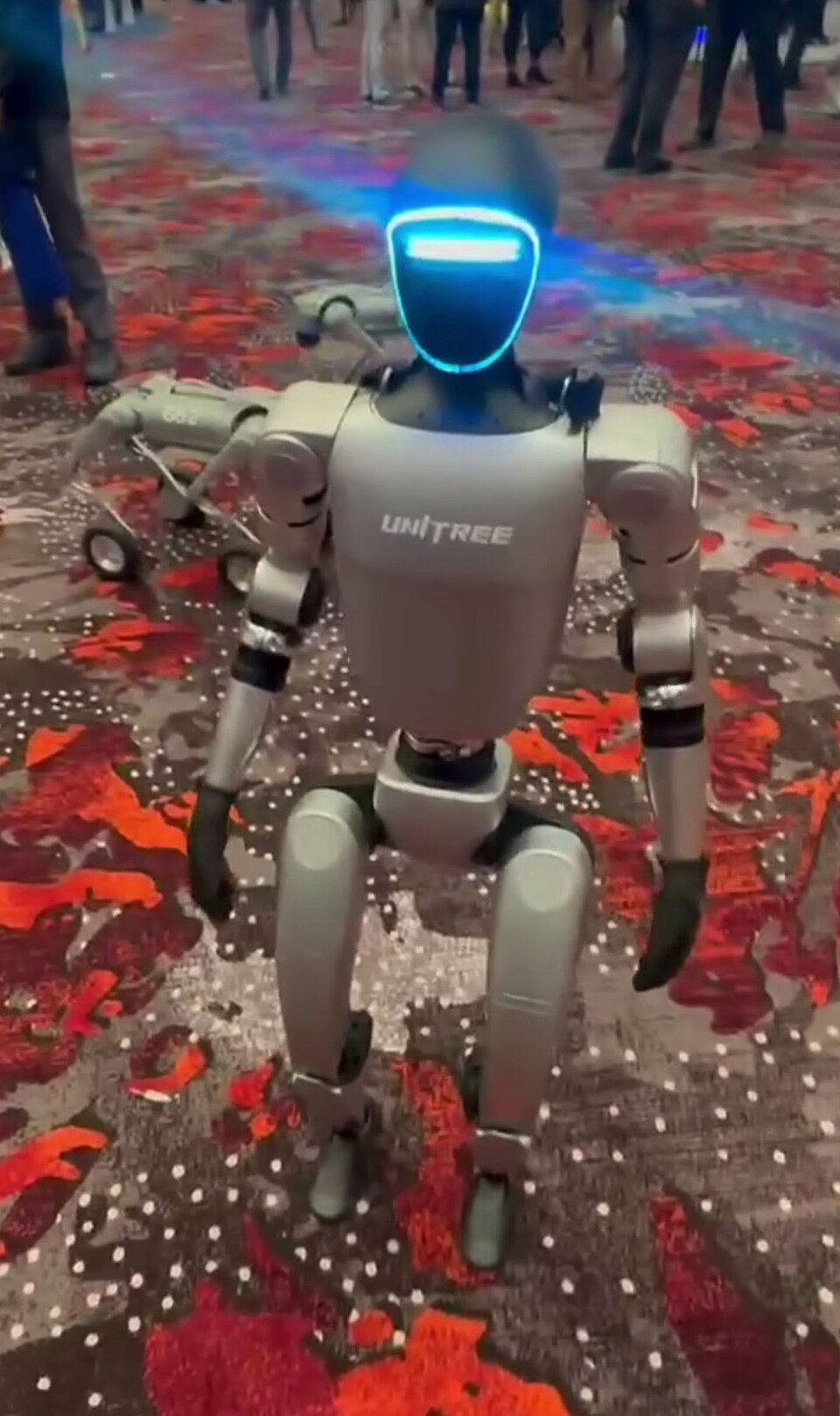 A Unitree G1 humanoid robot on the show floor at UAV Expo 2024.